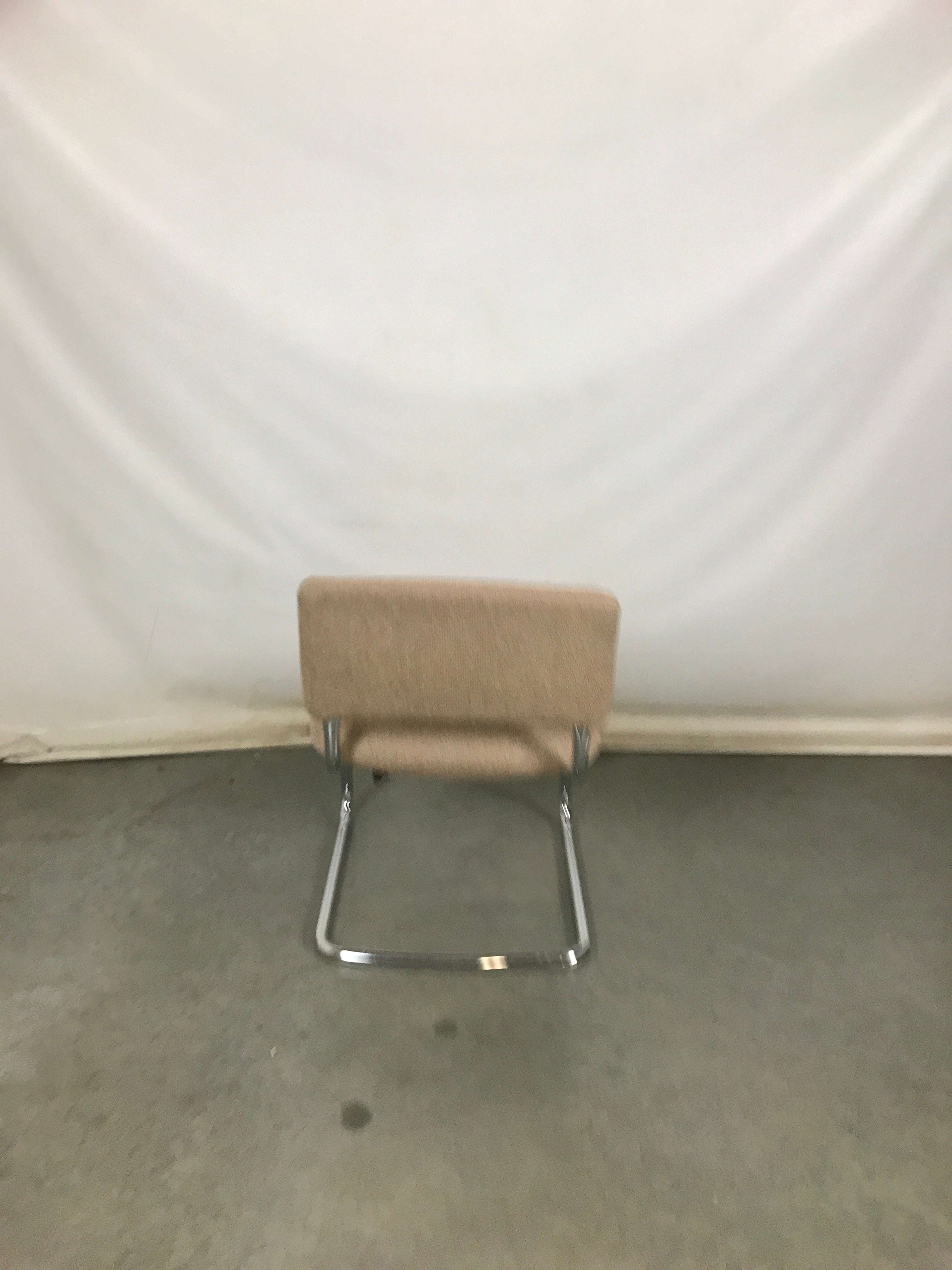 Beige Uphostered Chair with Metal Bottom