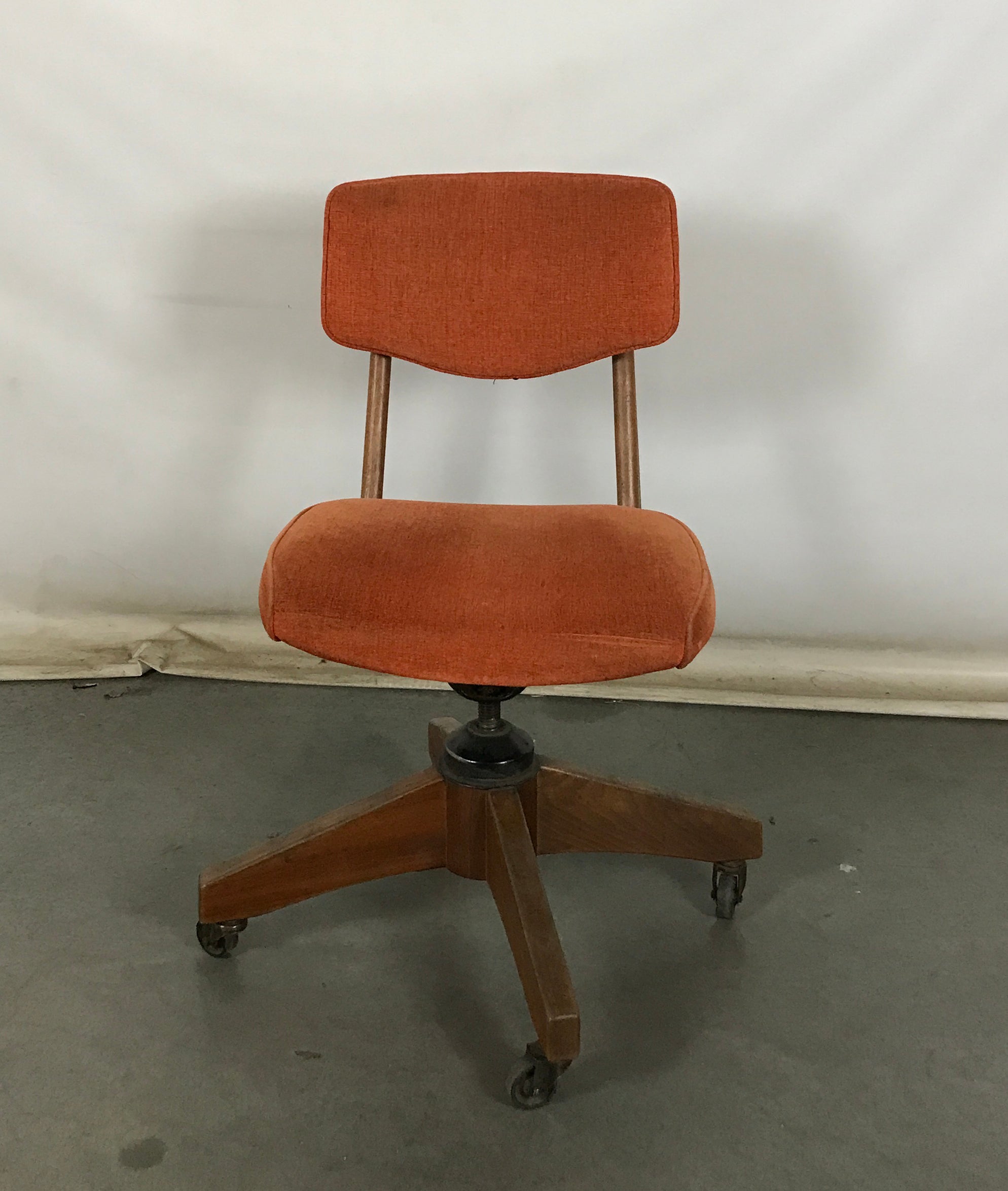Orange Upholstered Rolling Chair