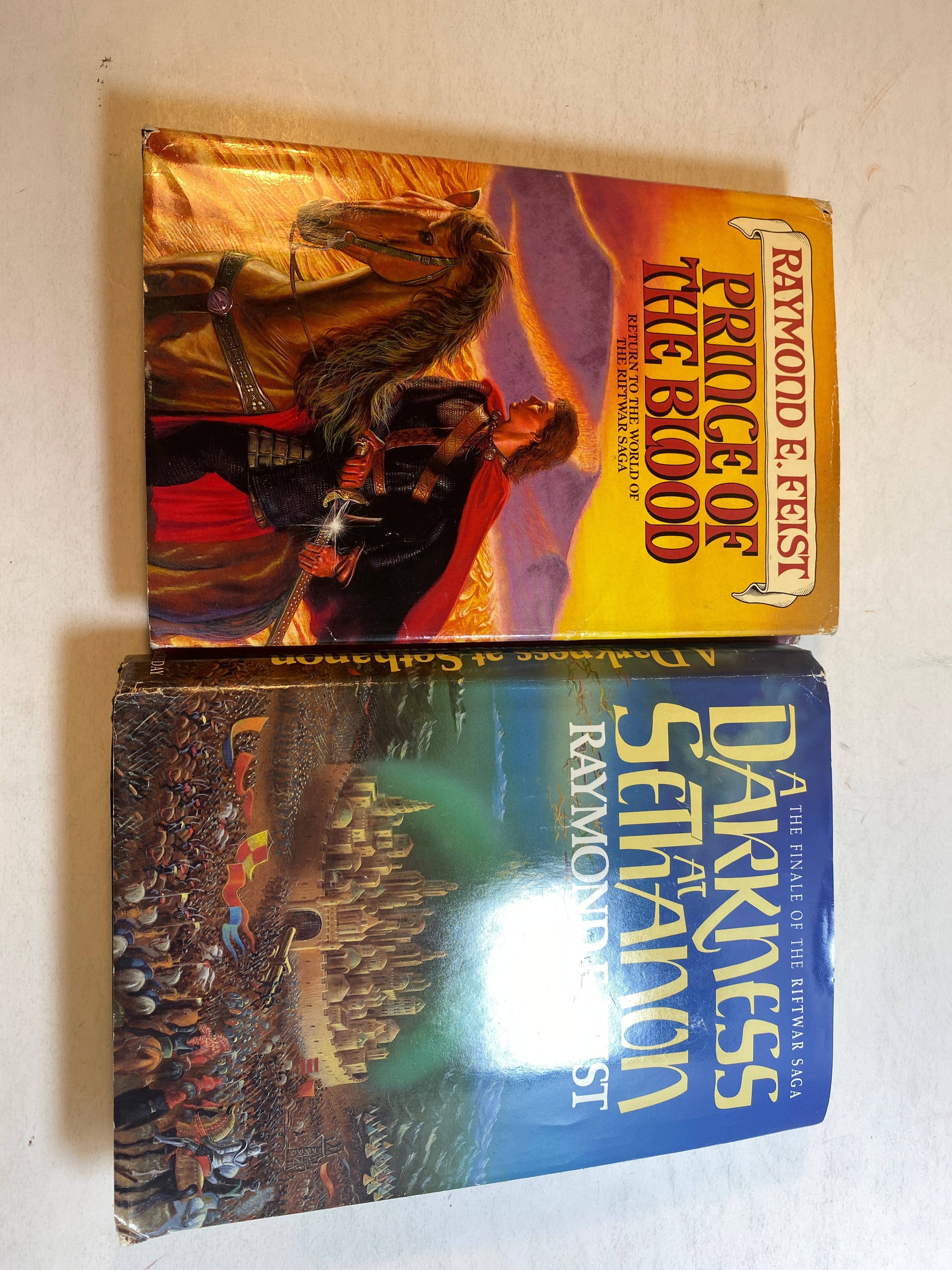 Lot of 2 Raymond Feist HCDJ Books 1986-1989