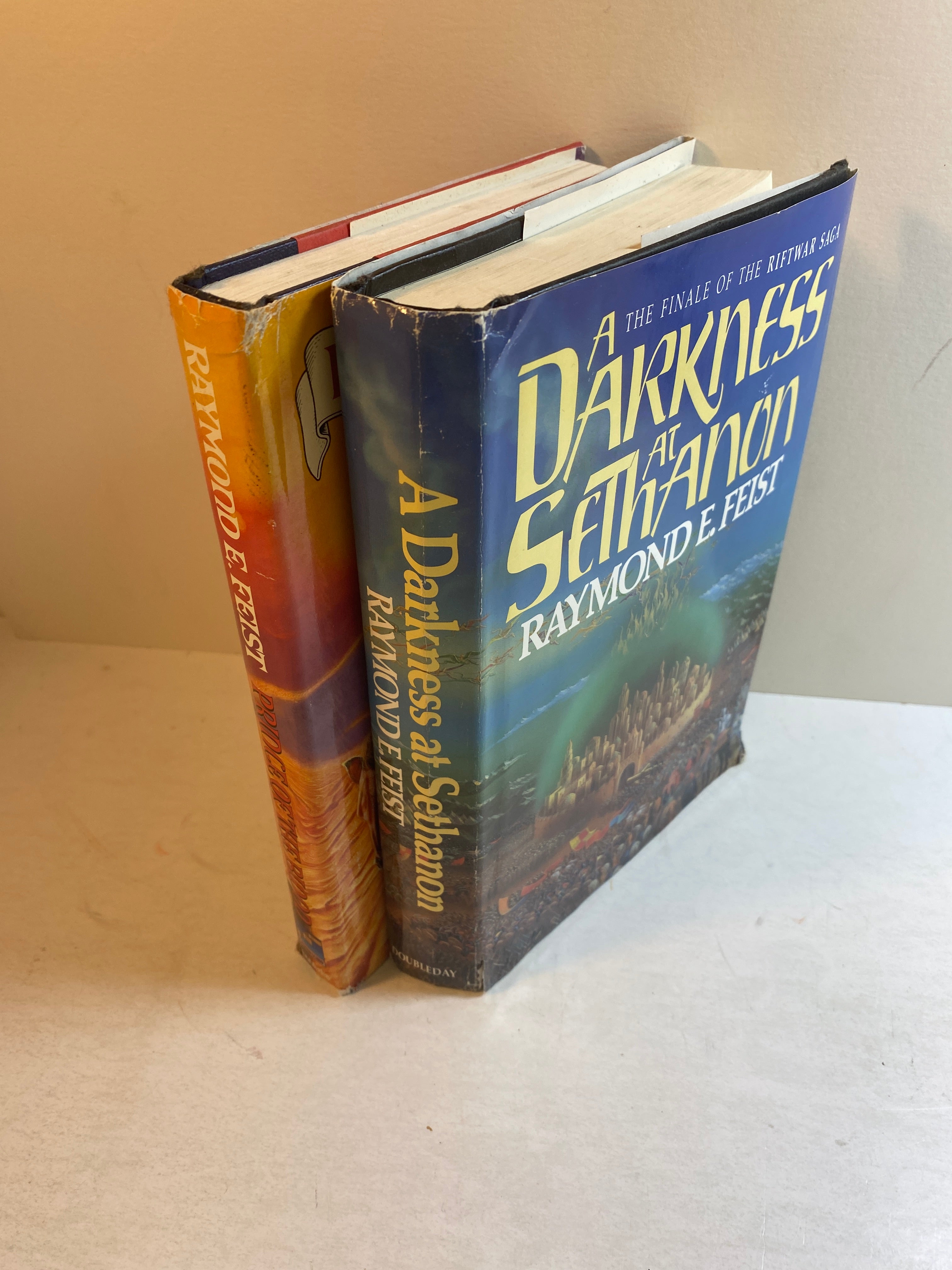 Lot of 2 Raymond Feist HCDJ Books 1986-1989