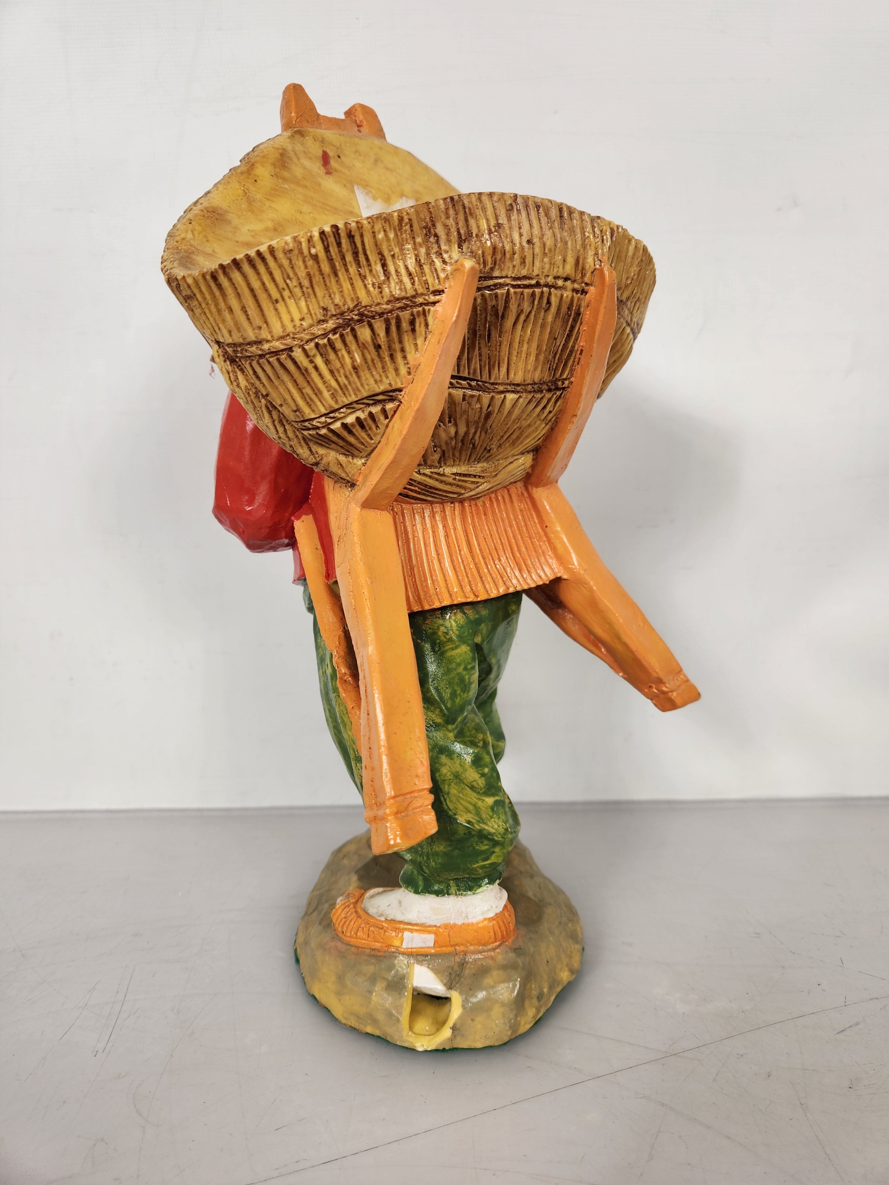 Person Carrying Basket Figurine