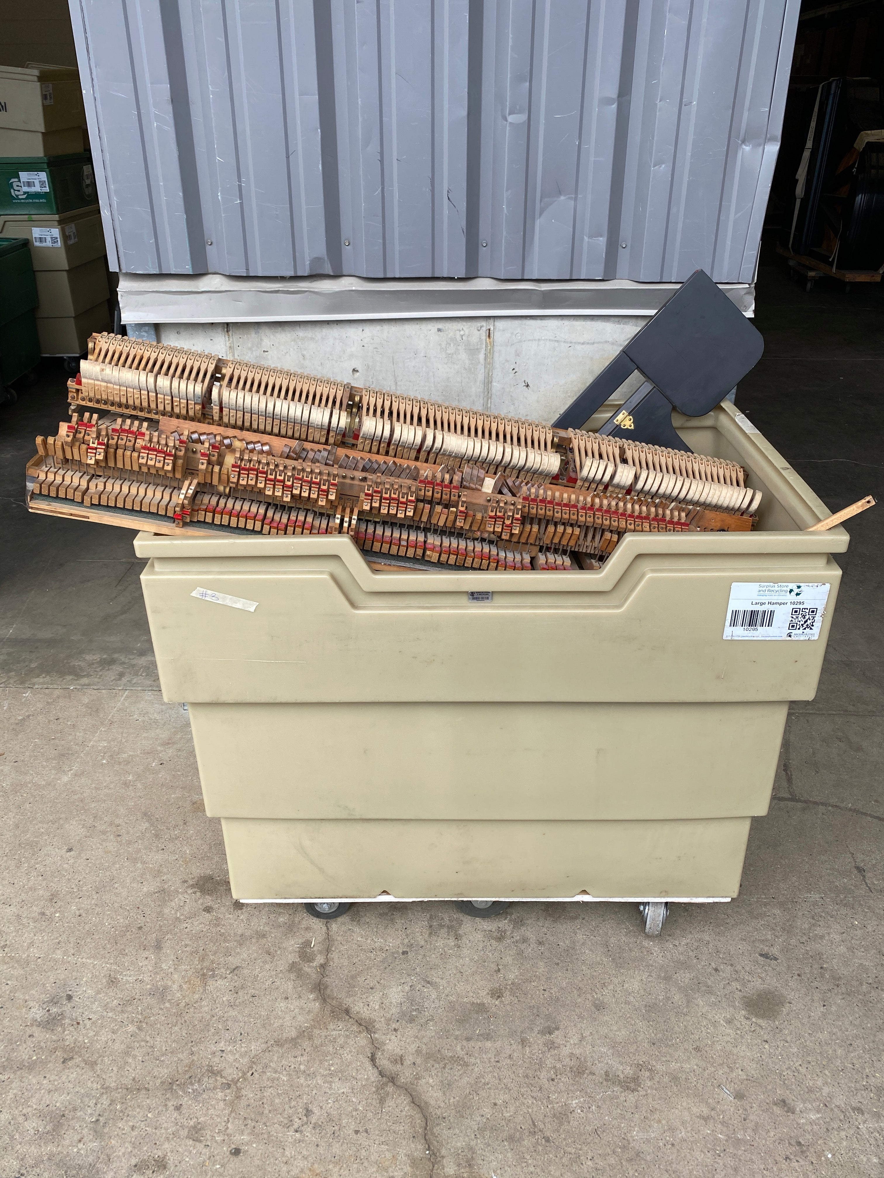 Disassembled Piano with Hamper Contents