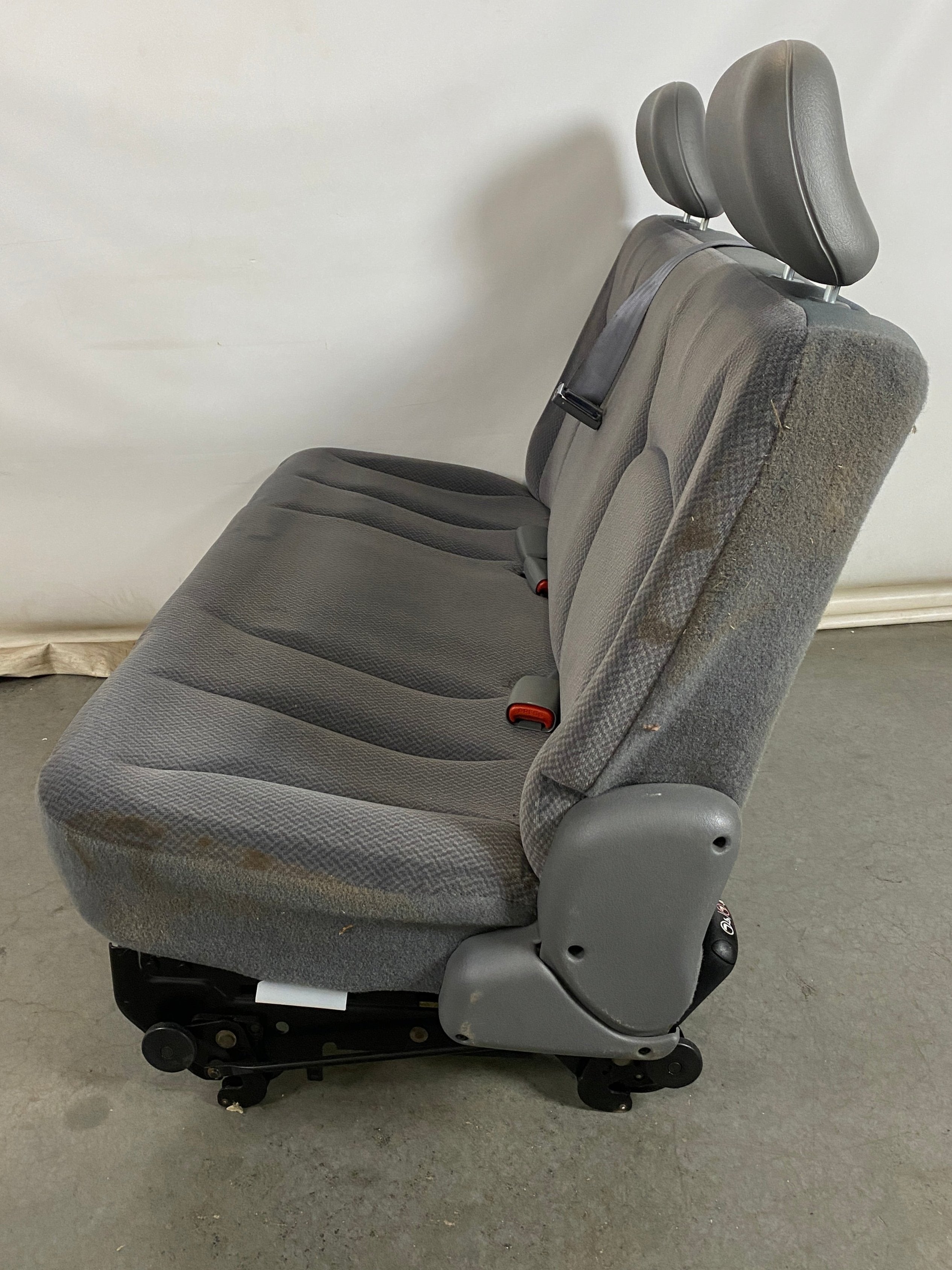 Gray Van Rear Seating with Seat Buckles