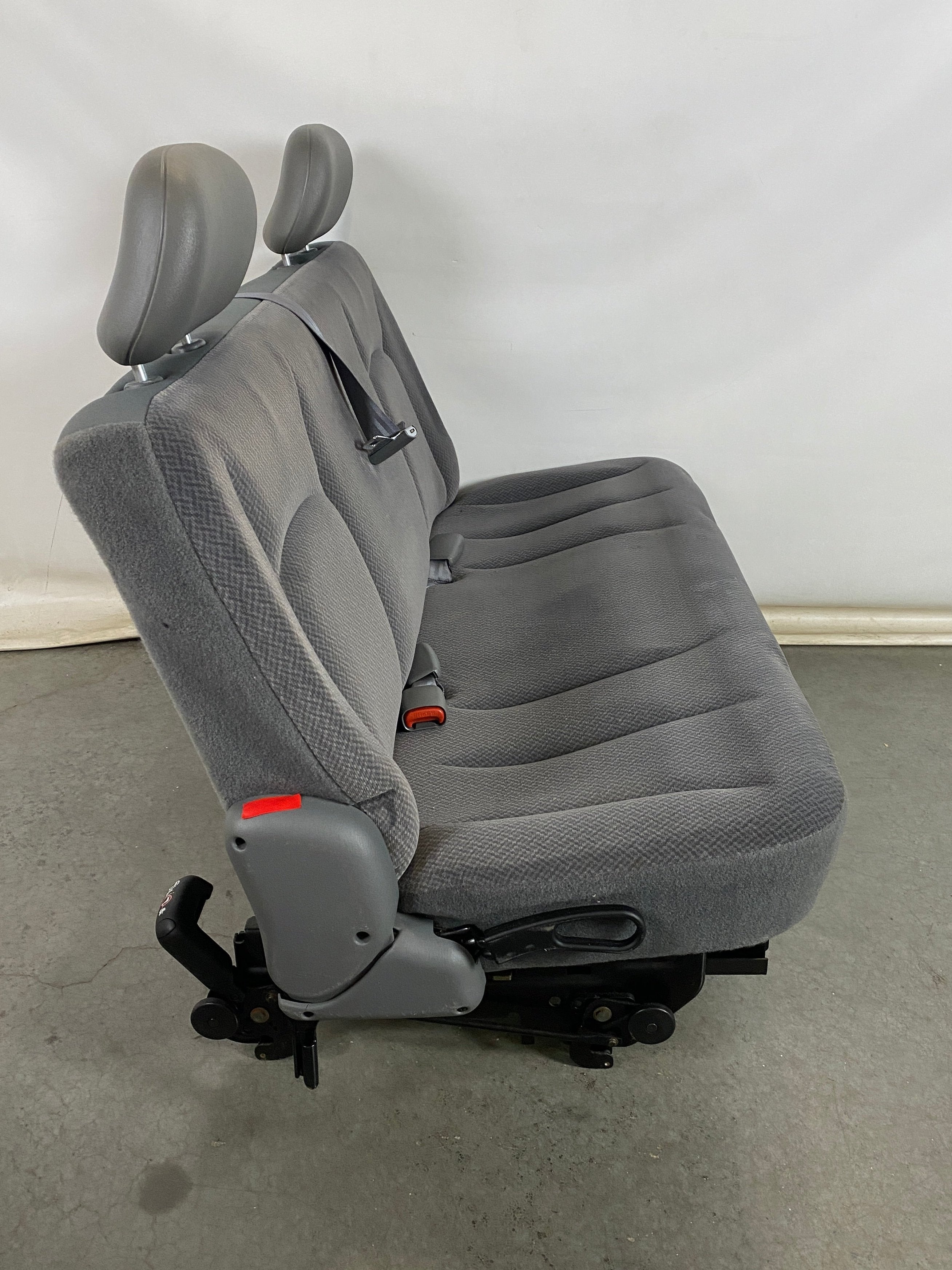 Gray Van Rear Seating with Seat Buckles