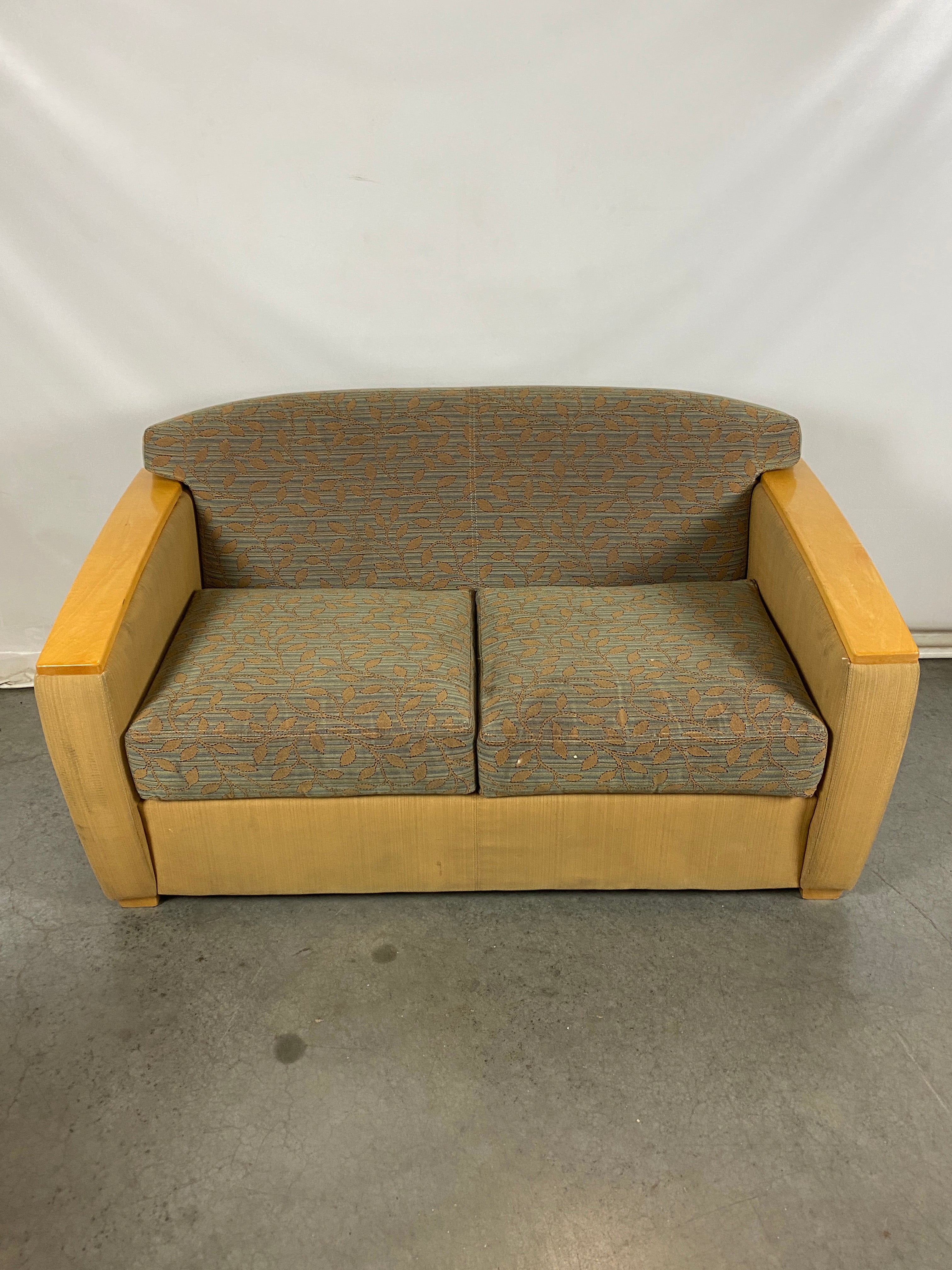 Light Patterned Lounge Couch with Wooden Arms