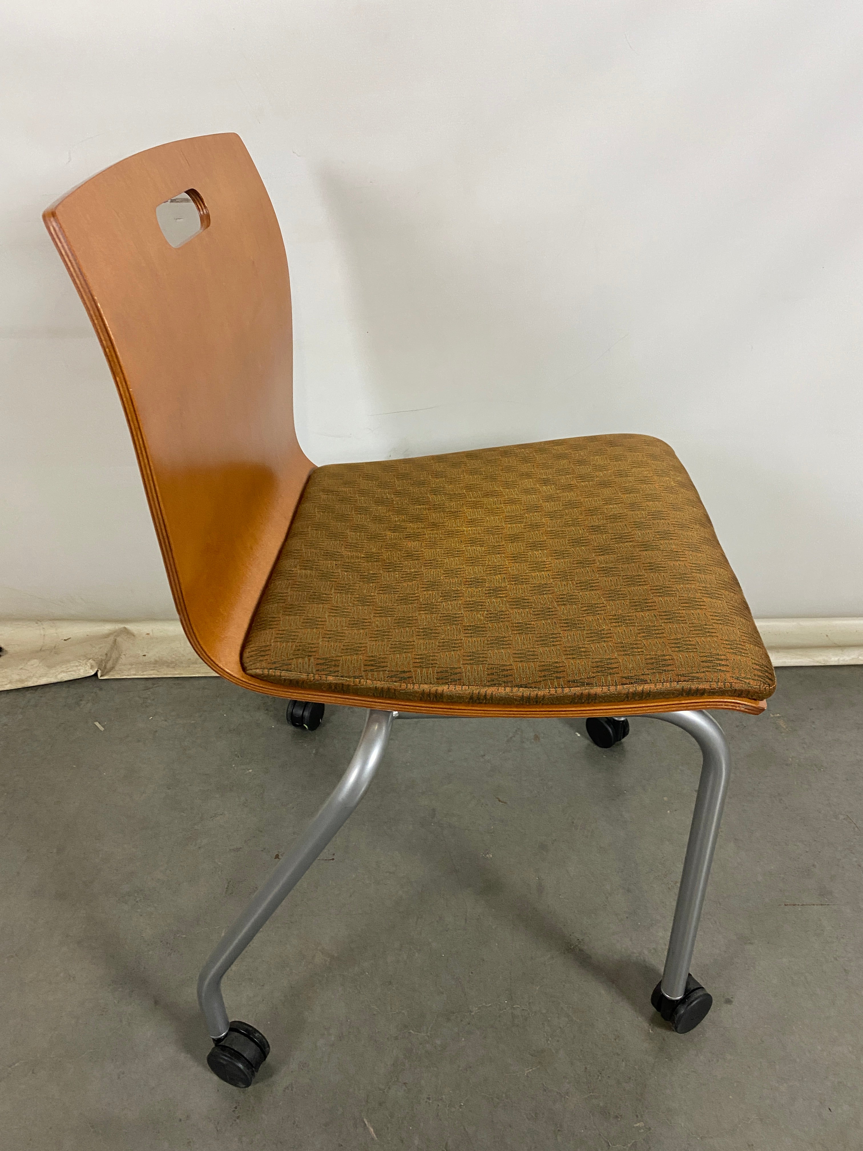 Metropolitan Furniture Corp. Wooden Rolling Chair with Brown Upholstered Seat