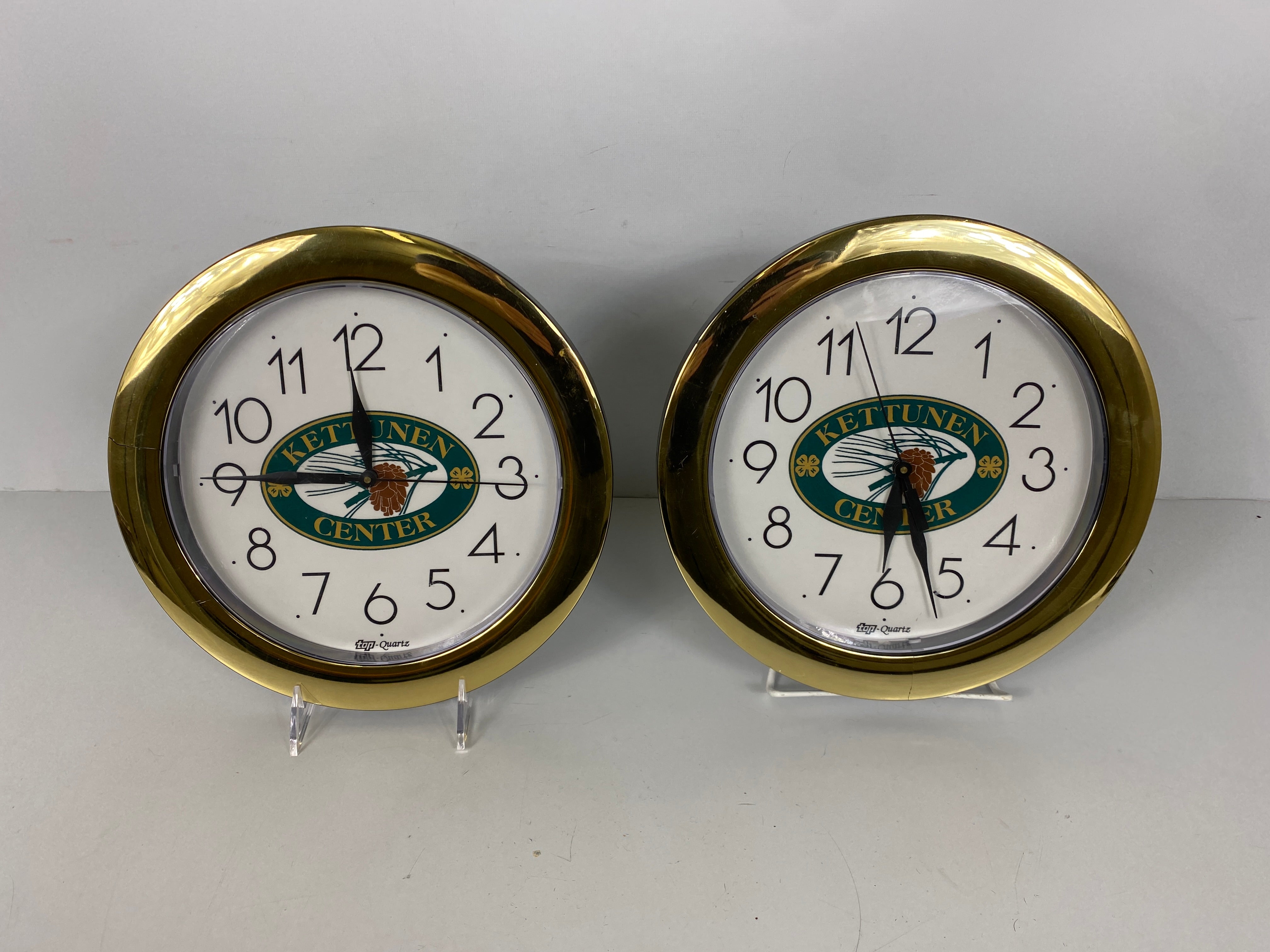 Pair Kettunen Center Top Quartz Wall Clocks *Cracked Frames*