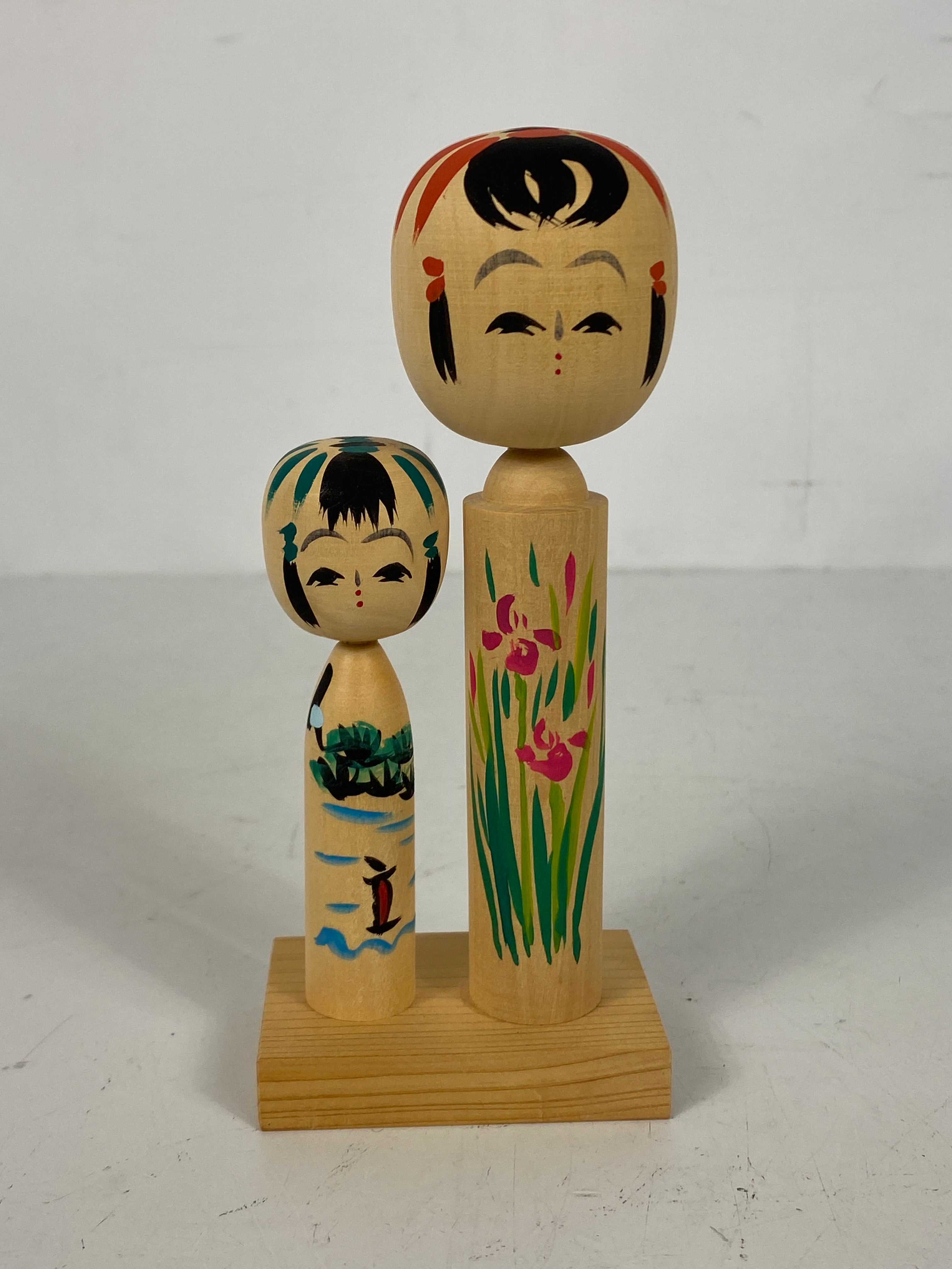 Pair of Japanese Kokeshi Dolls on Base