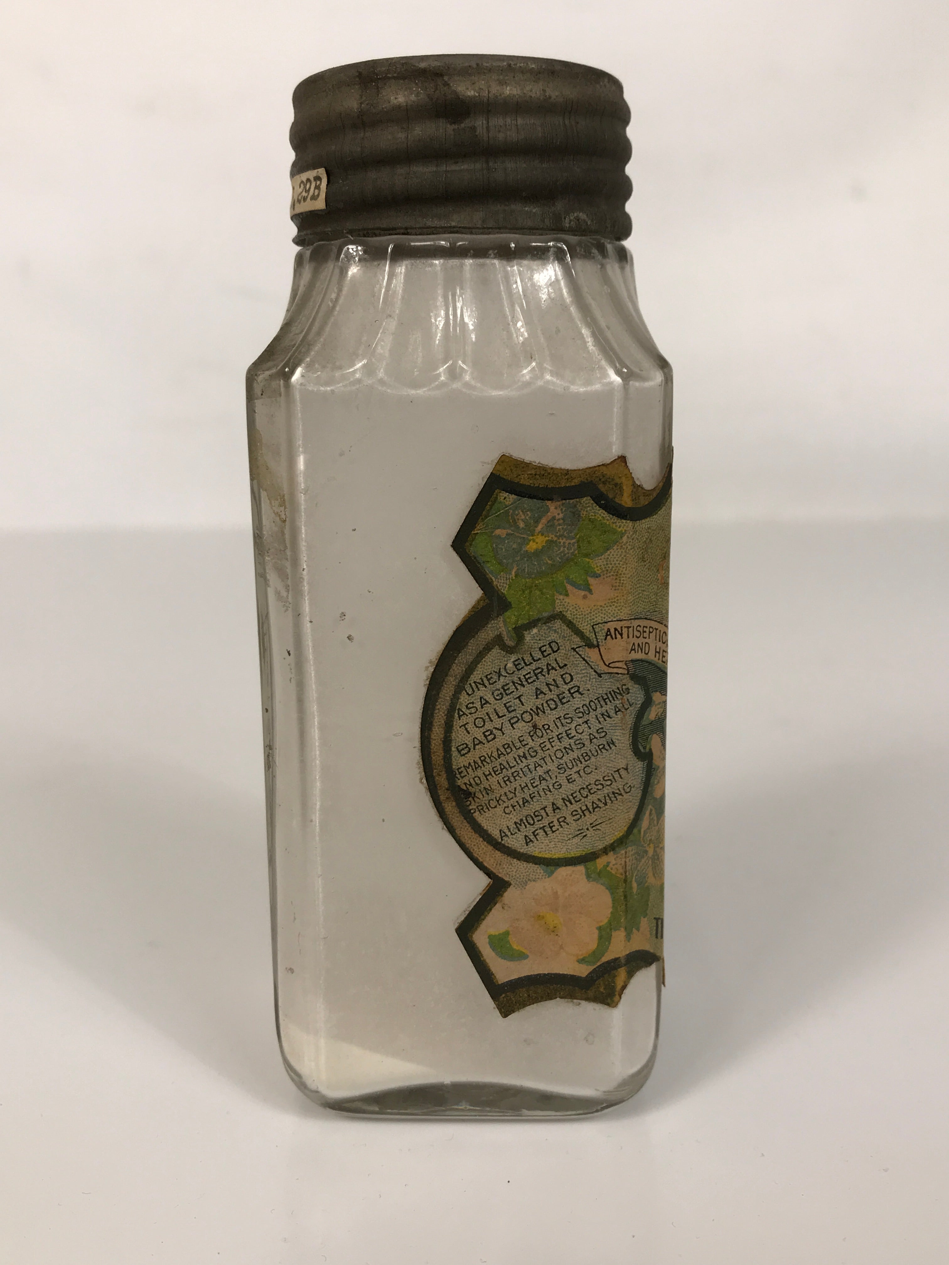 Antique Rawleigh's Toilet & Baby Powder Embossed Glass Bottle with Label