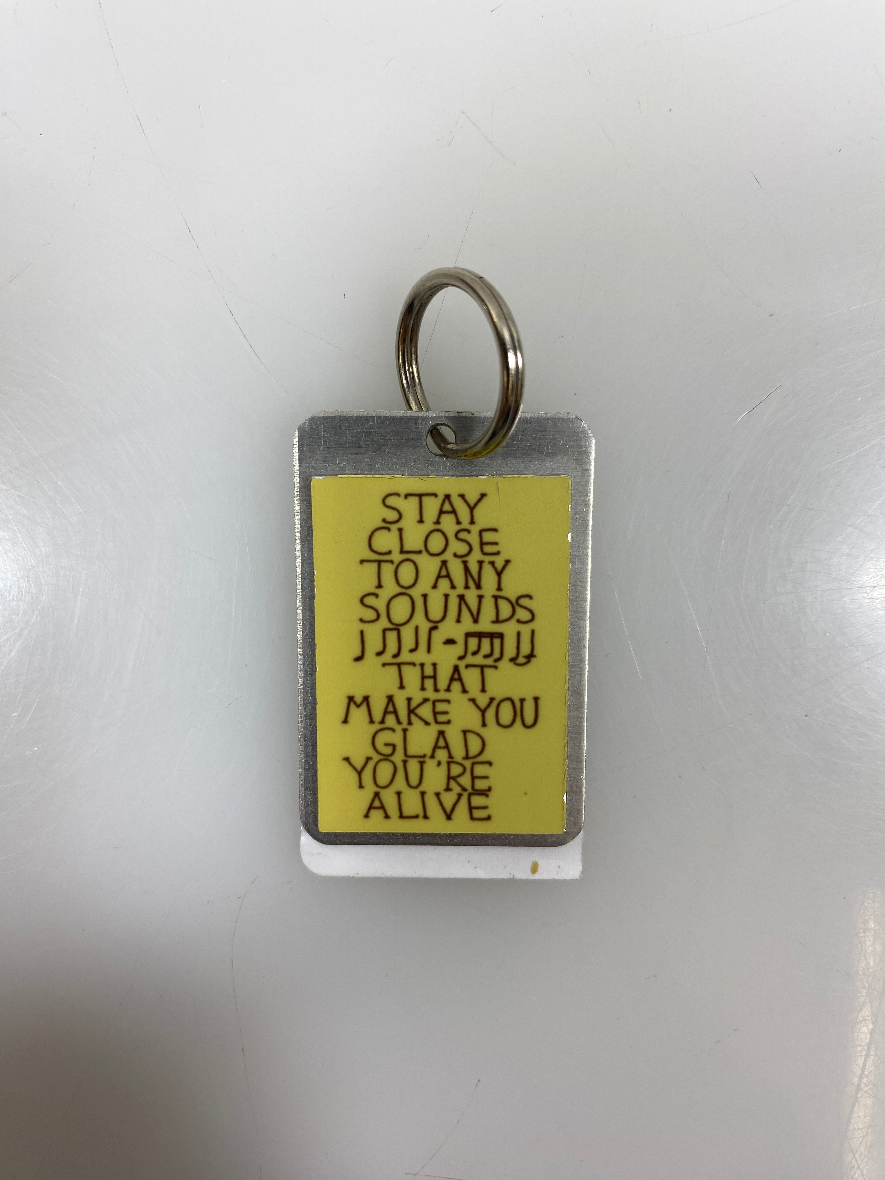 Silver Stay Close To Any Sounds That Make You Glad You're Alive Keychain