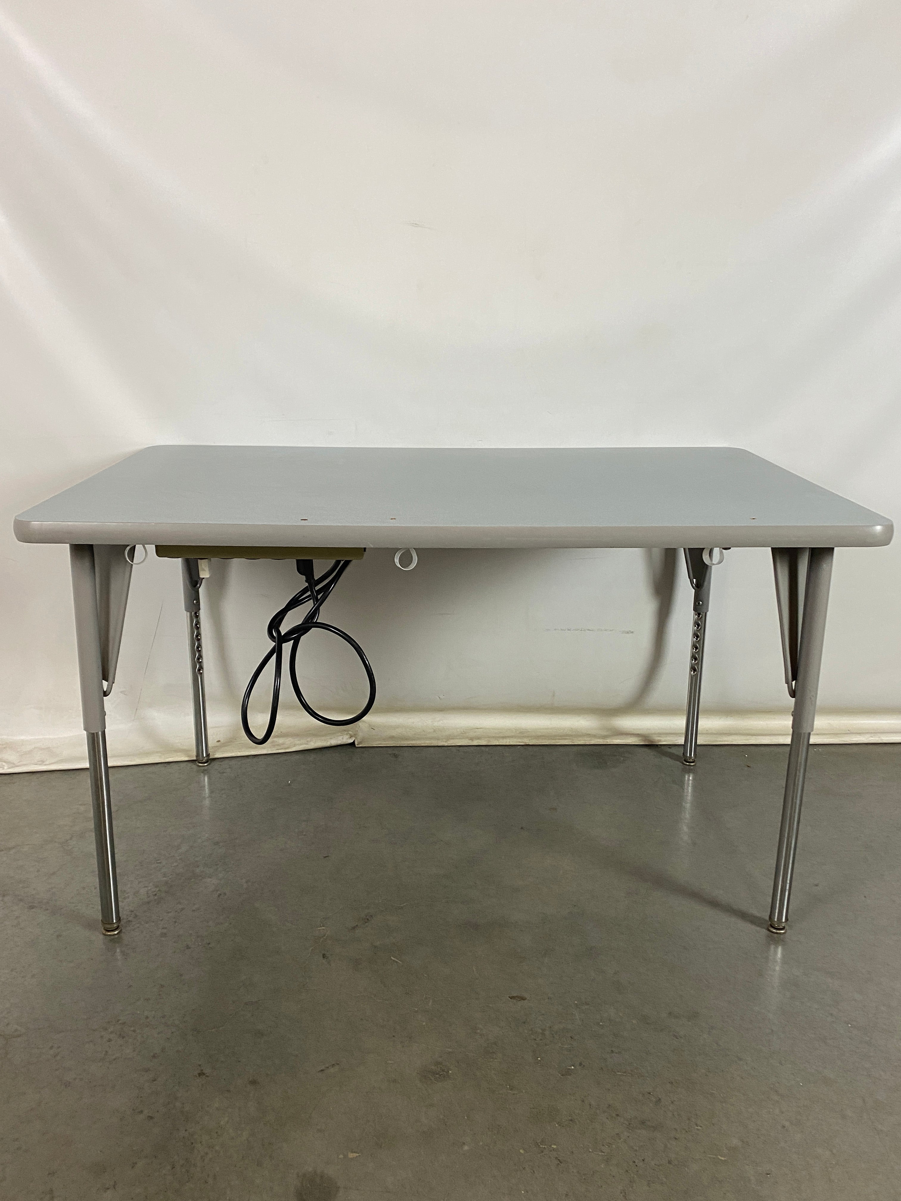 Gray Laminate Table With Power Strip