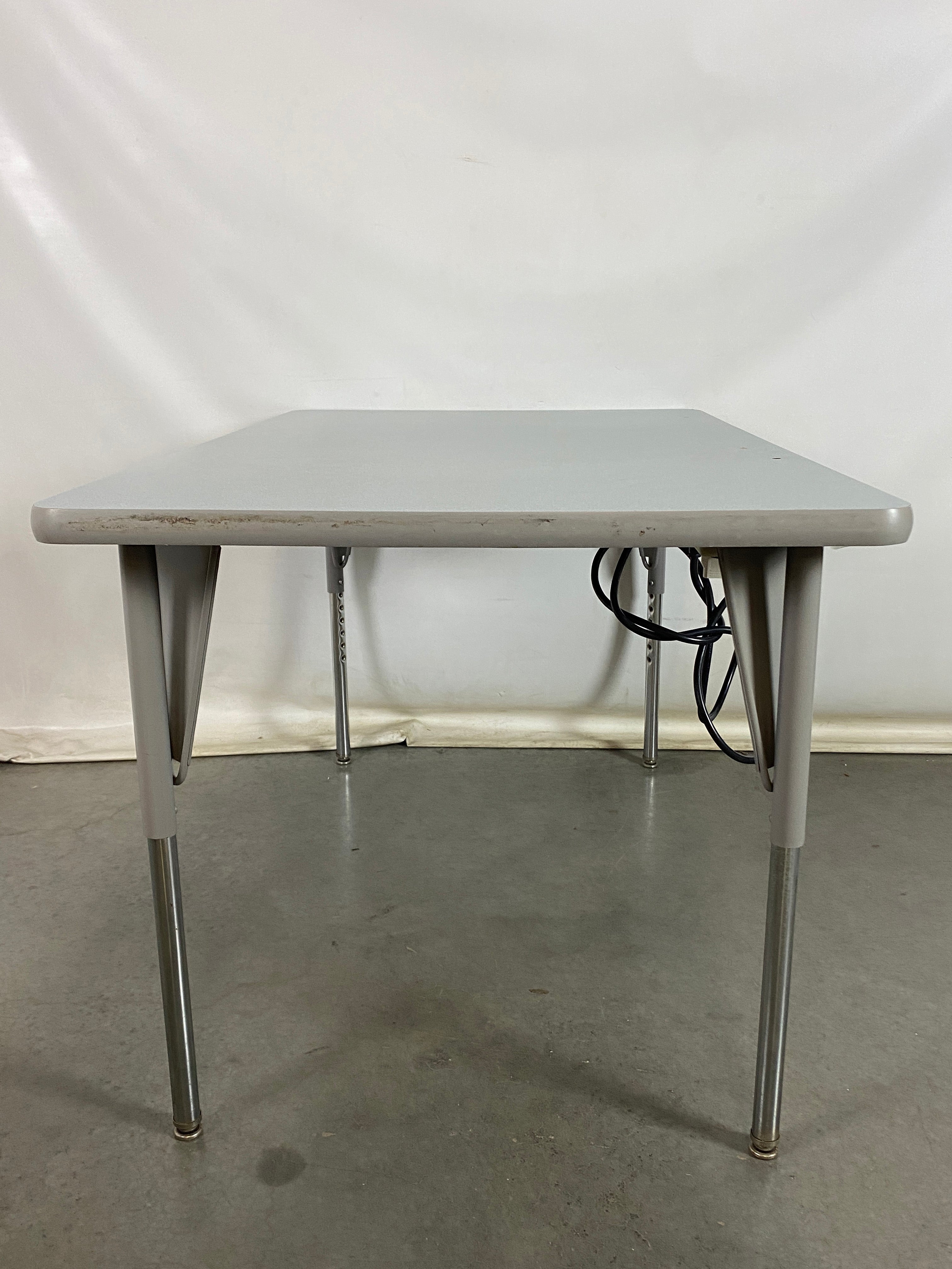 Gray Laminate Table With Power Strip