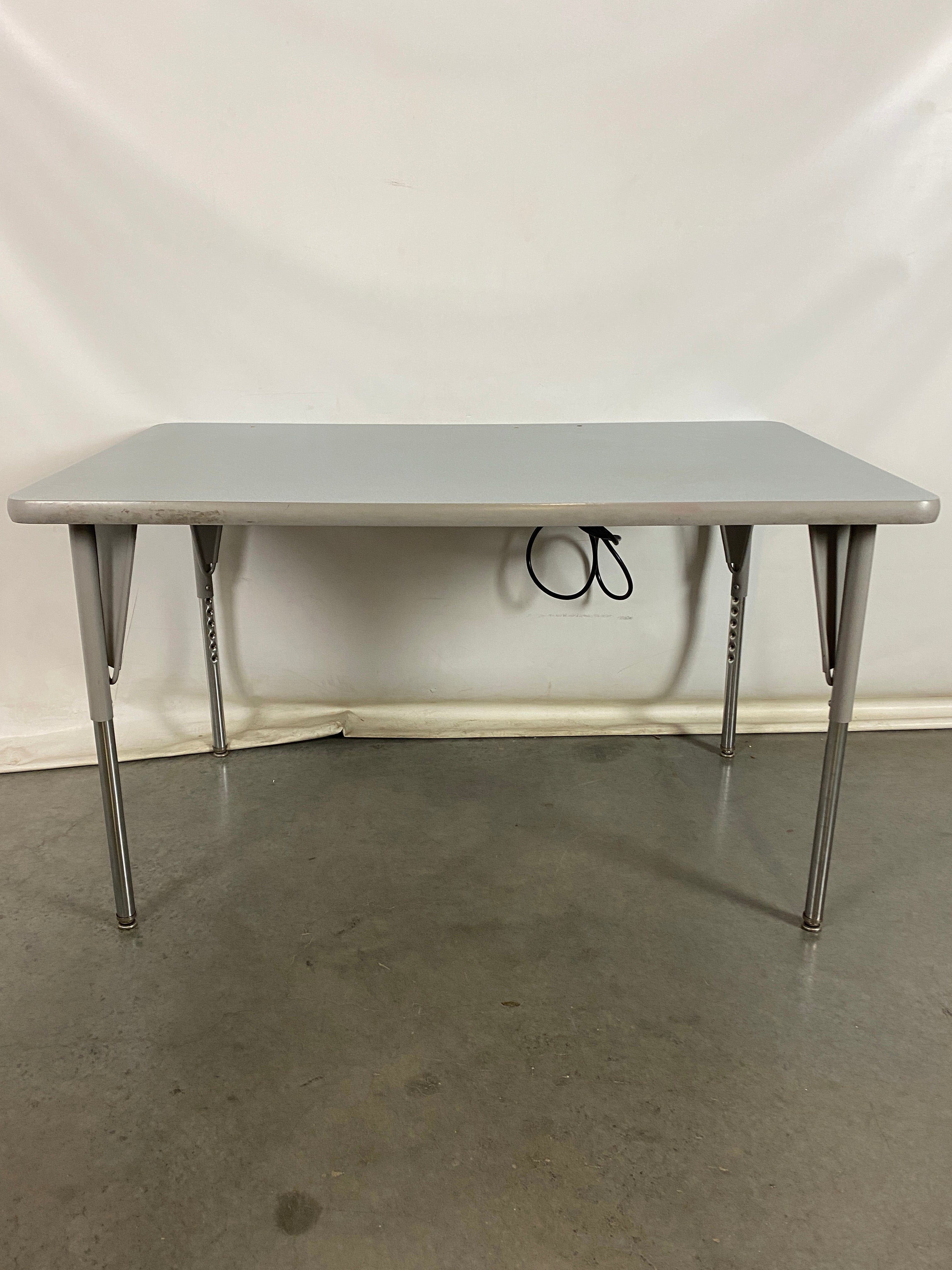 Gray Laminate Table With Power Strip