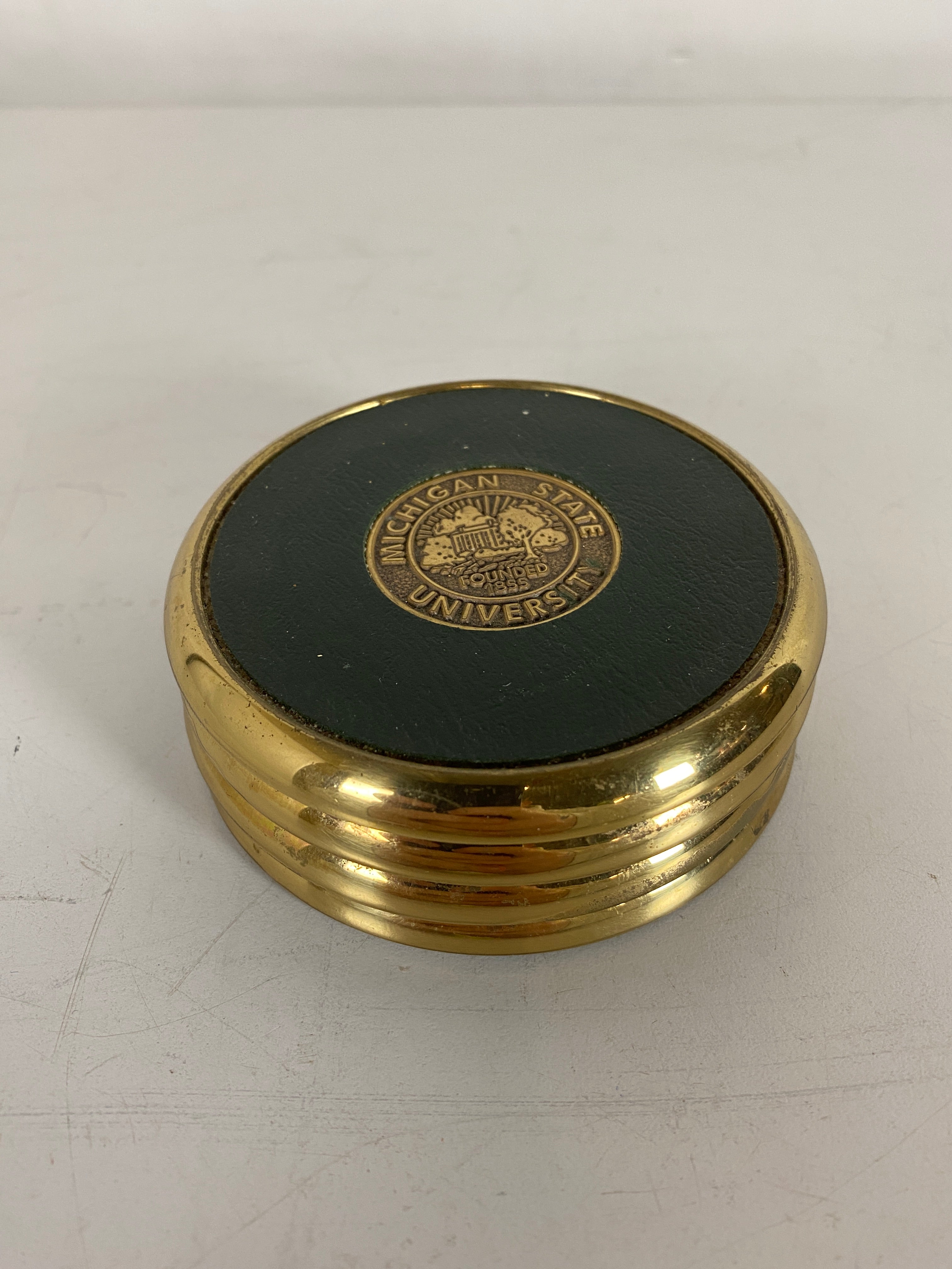 Set of 4 Brass MSU Coasters