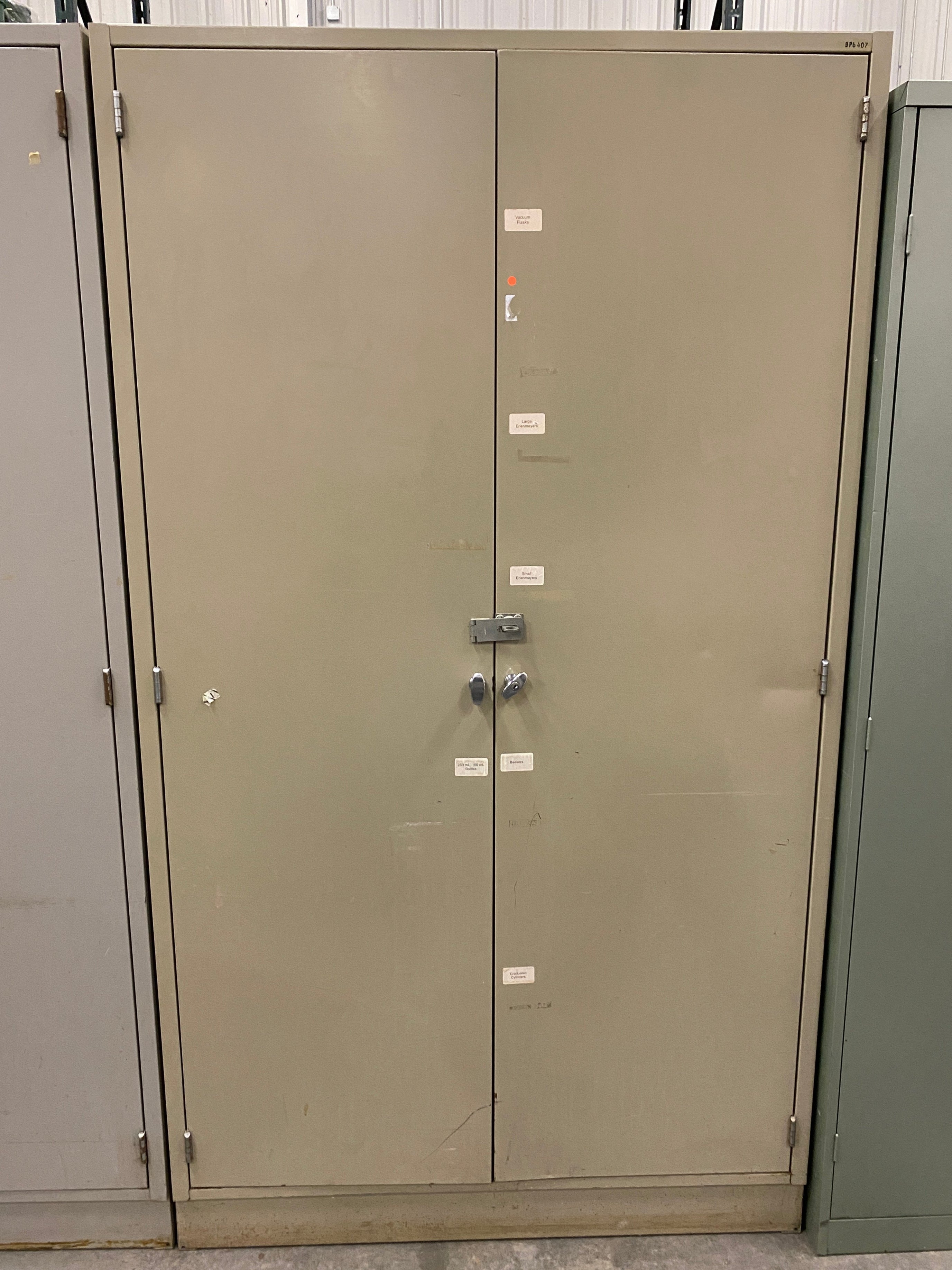 Tan 2 Door Cabinet w/ Adjustable Shelves