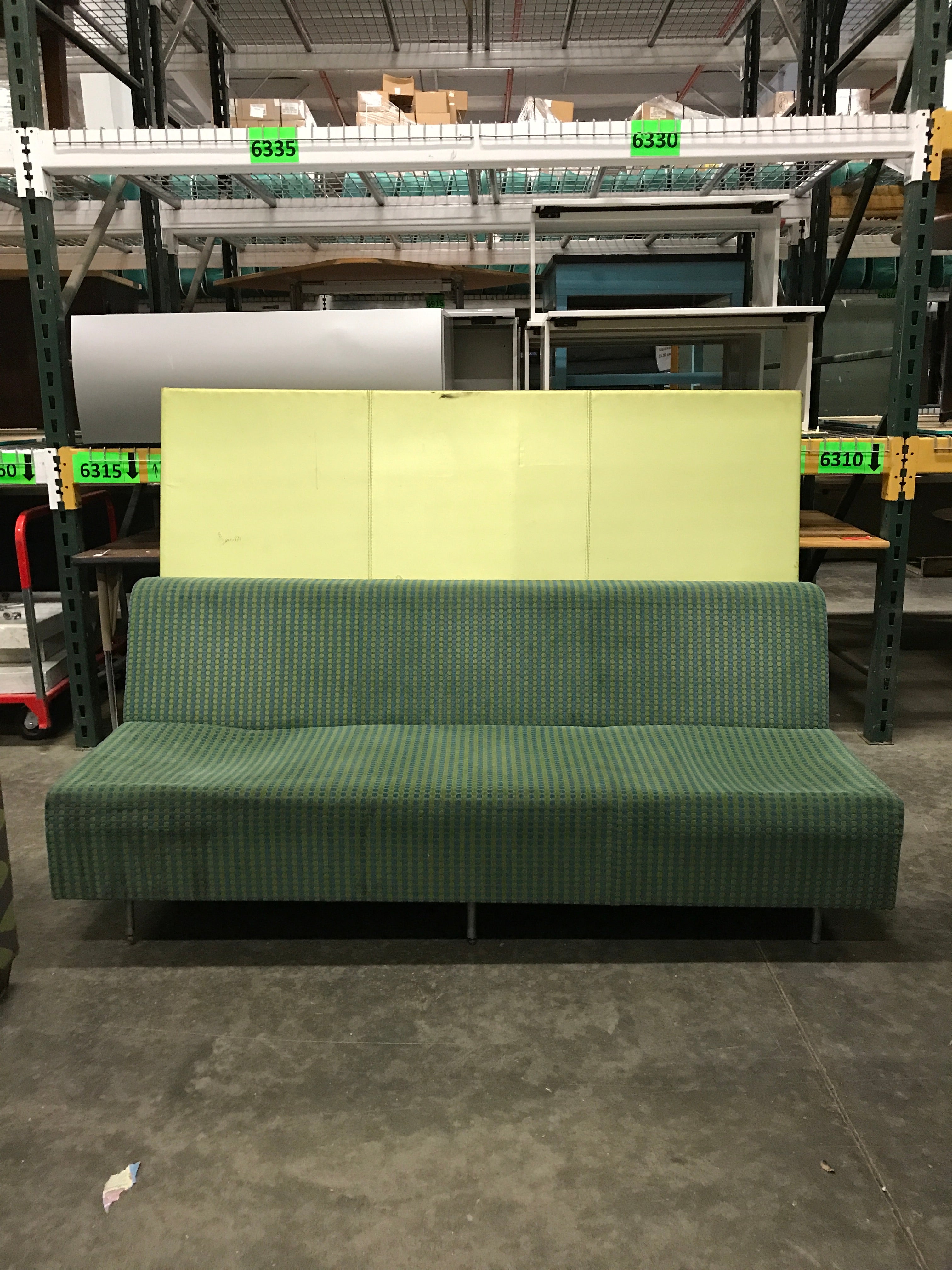 Blue Upholstered Couch with Green Backboard