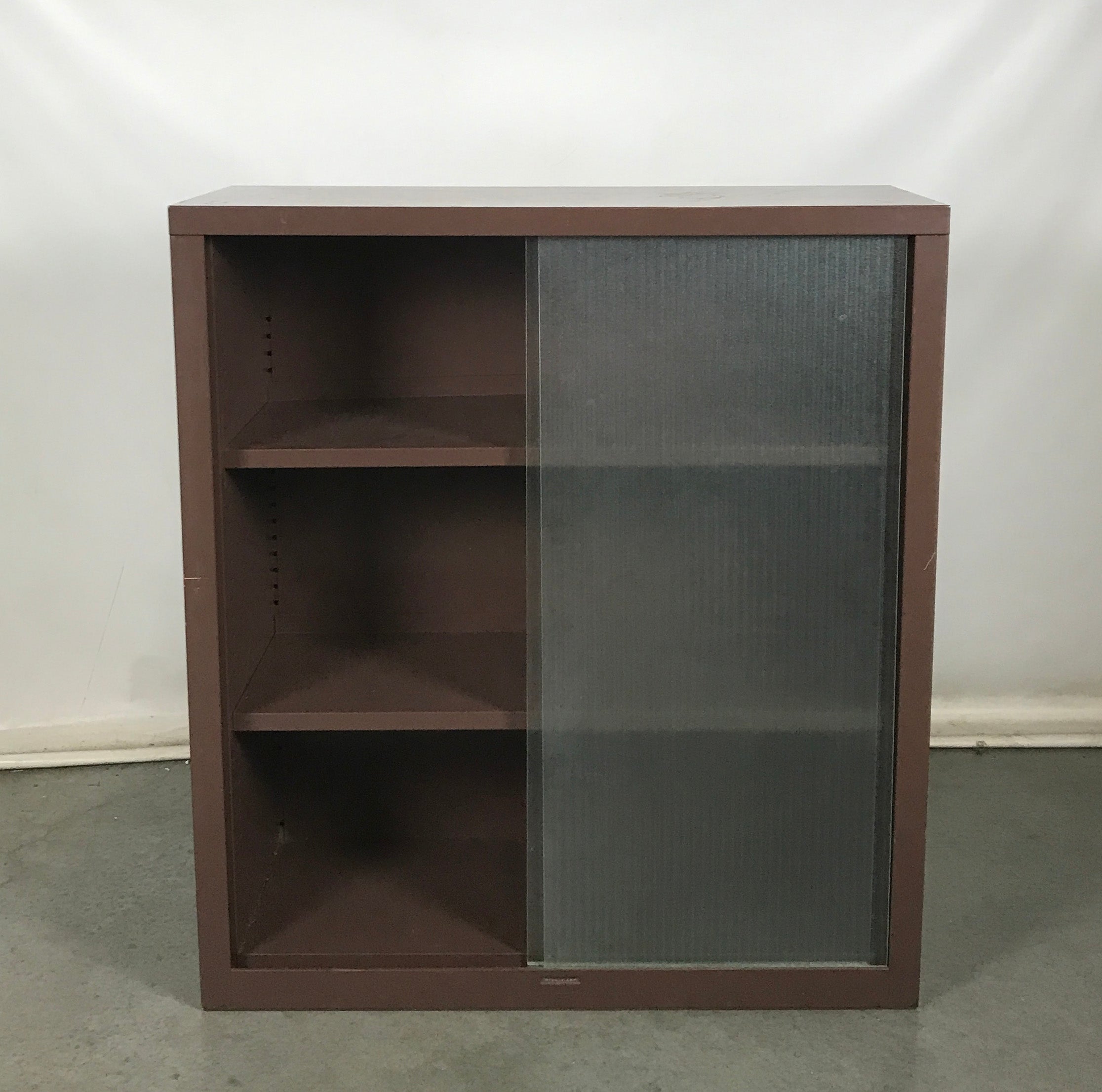 Brown Metal Cabinet With Sliding Glass Doors