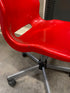 Red Plastic Chair on Wheels