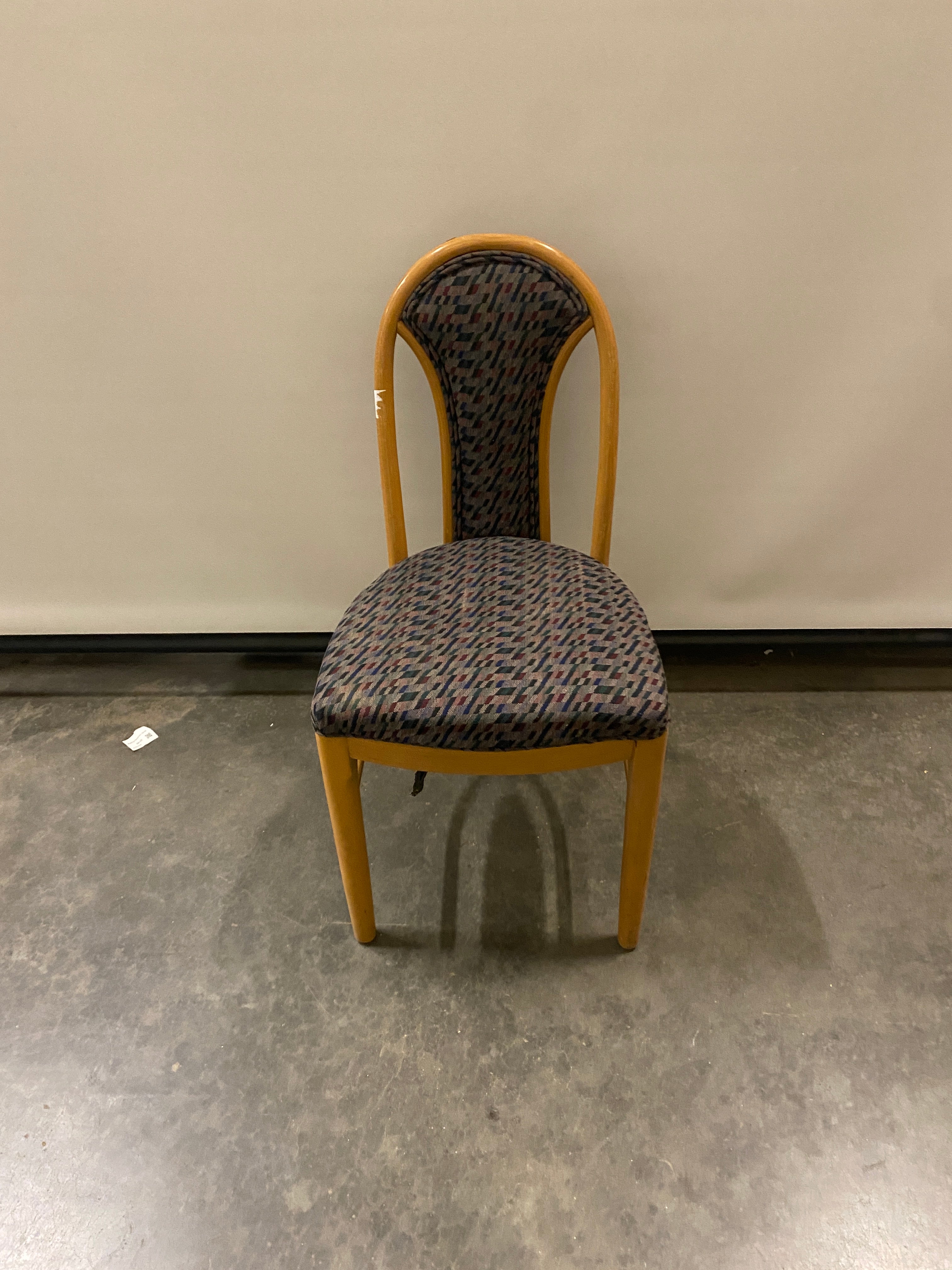 Blue Geometric Patterned Chair with a Wooden Frame