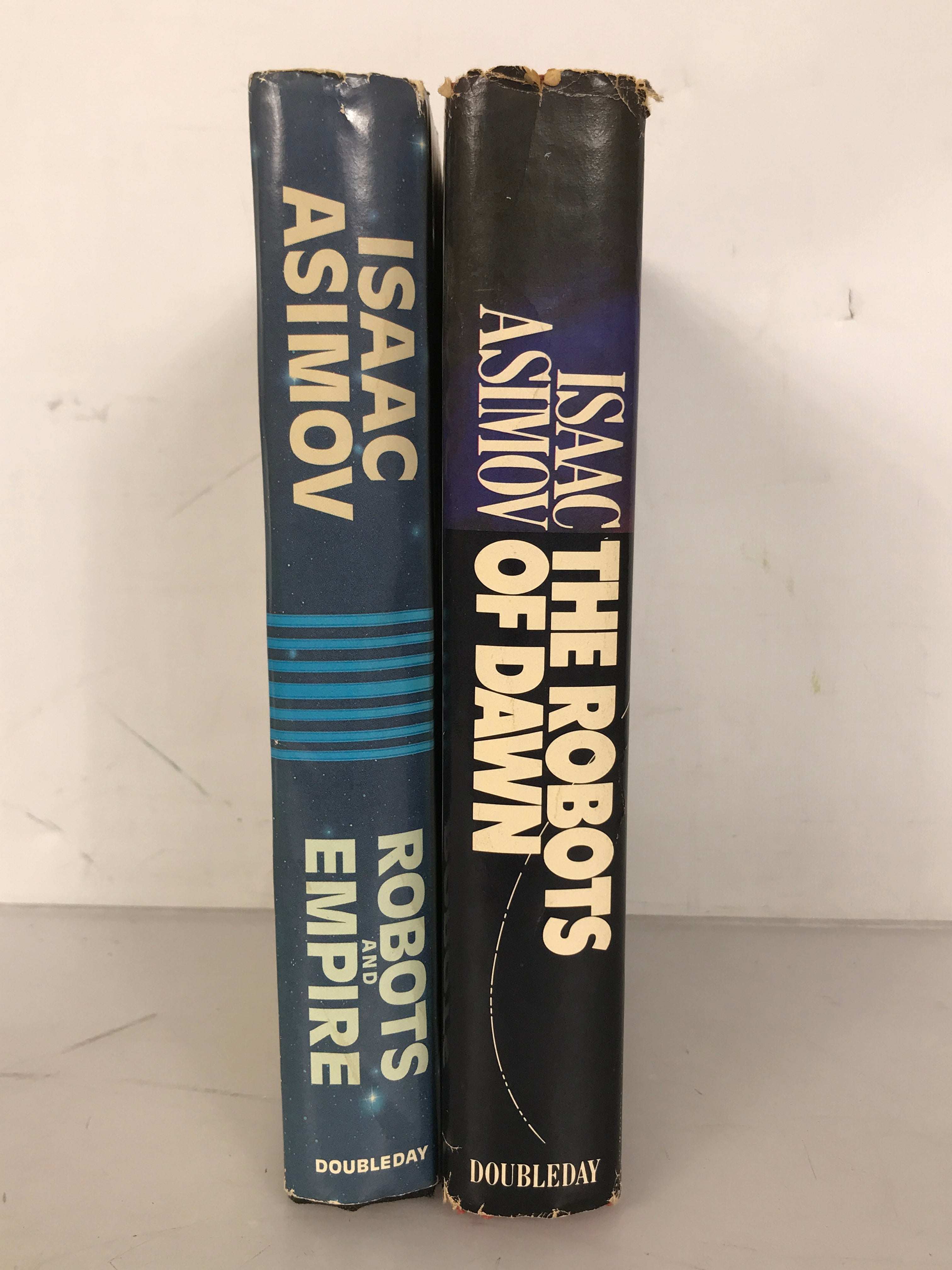 Lot of 2 Isaac Asimov First Editions: The Robots of Dawn (1983) and Robots and Empire (1985) HC DJ