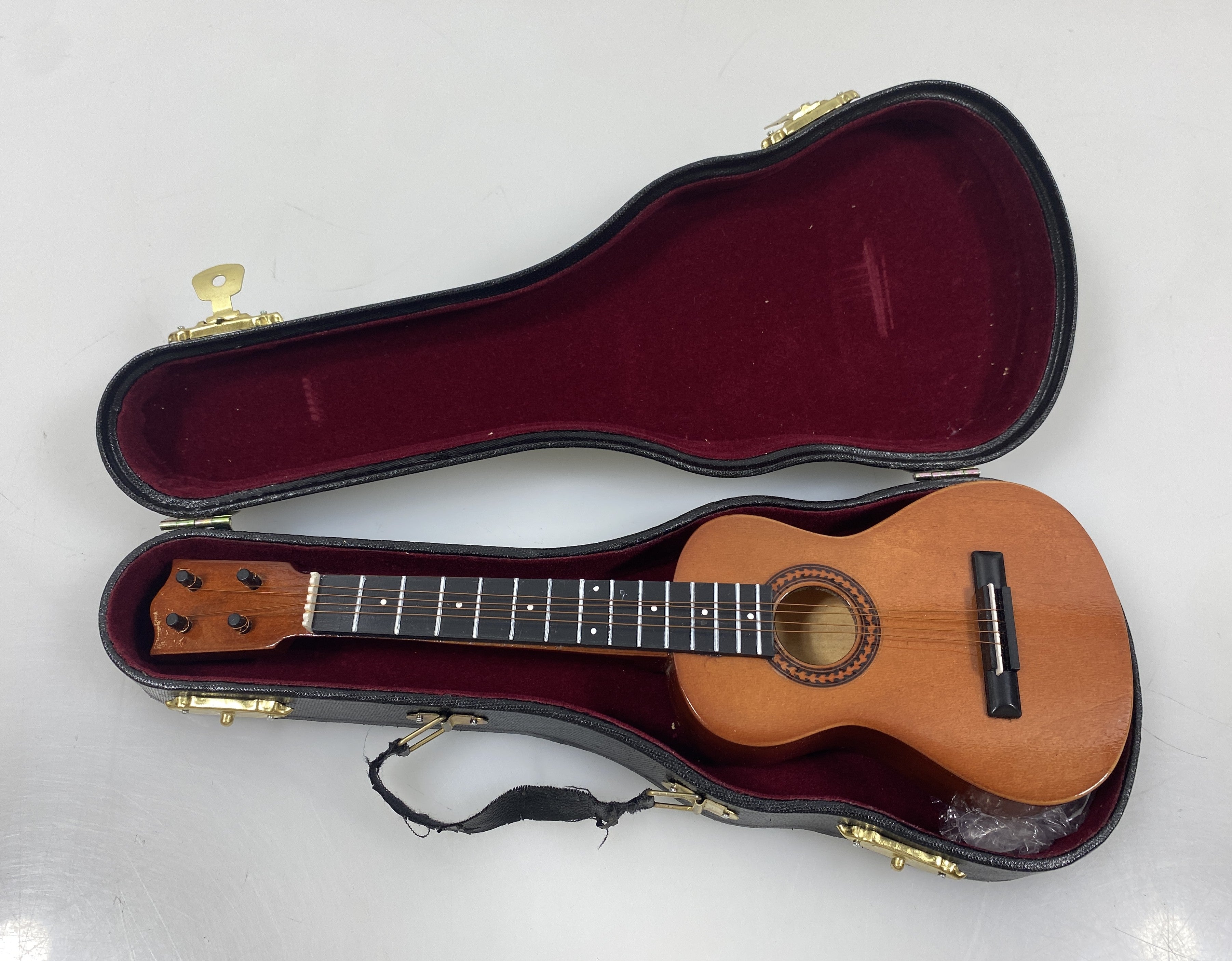 Miniature Brown Ukulele With Case And Stand