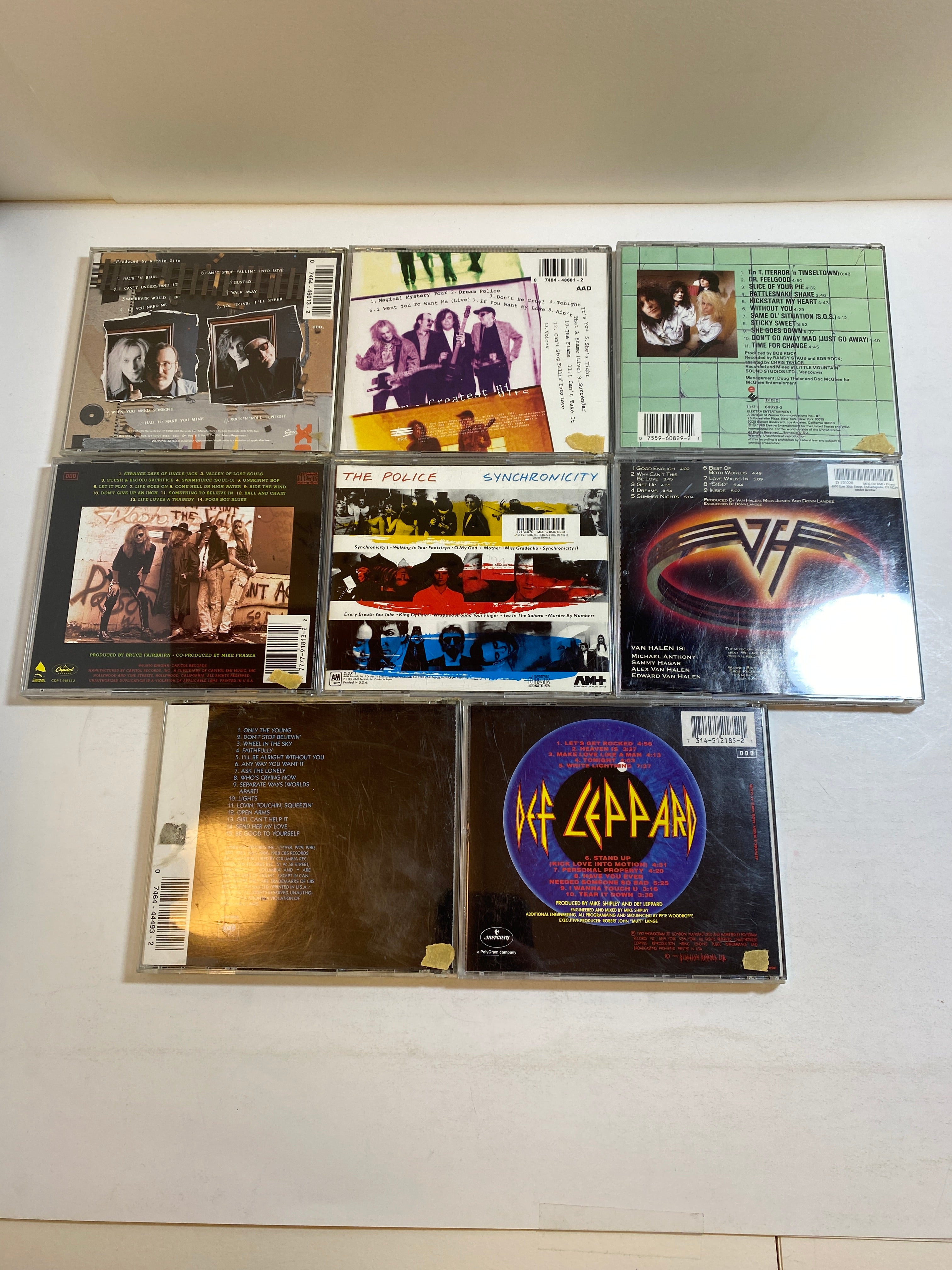 Lot of 8 1980s CDs Journey Def Leppard Poison Cheap Trick Motley Crus 1984-1992