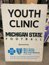Michigan State Football "Youth Clinic" "Blue Cross Blue Shield" Canvas Sign