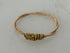 Restrung Gold and Peach Spring Wire Ring