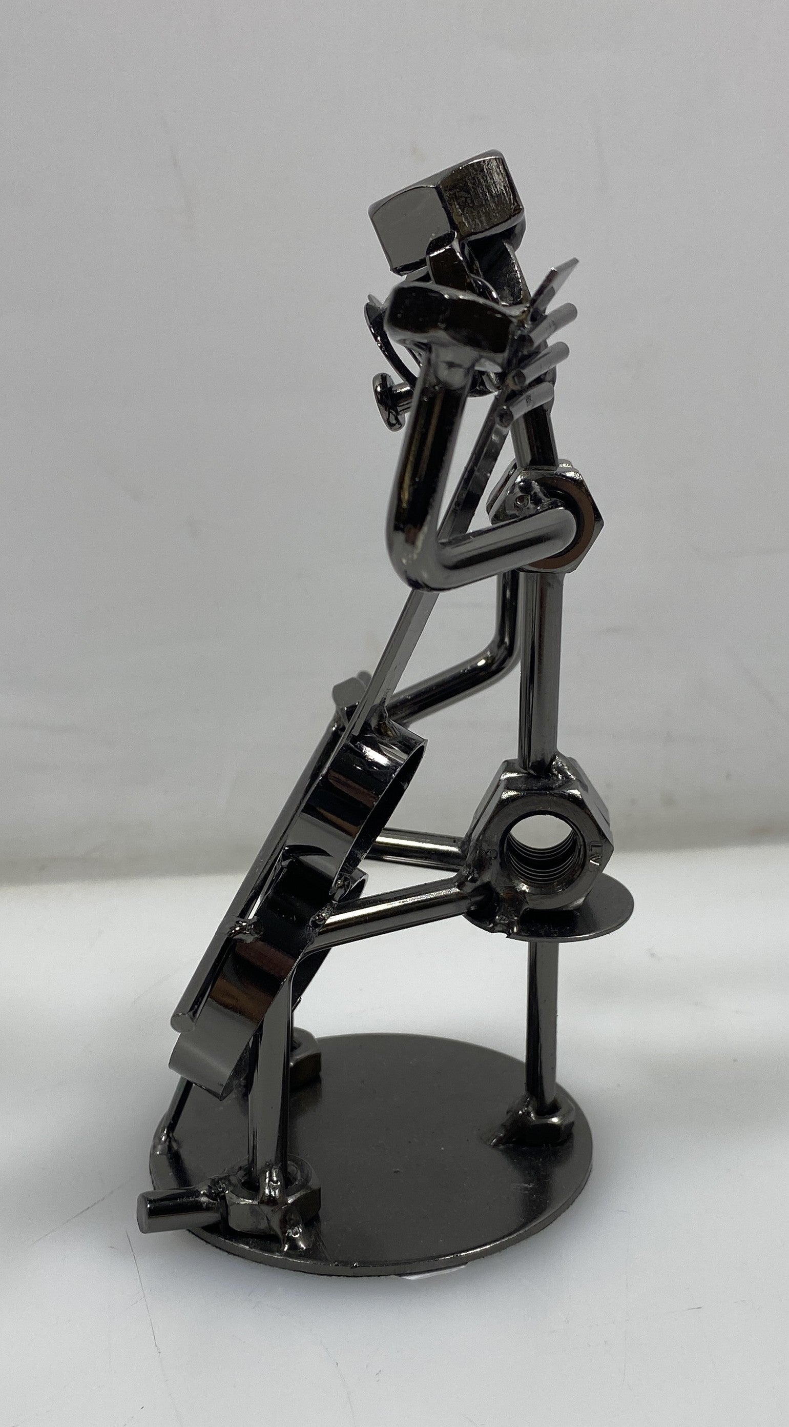 Silver Nuts and Bolts Cellist Metal Figurine With Circular Base