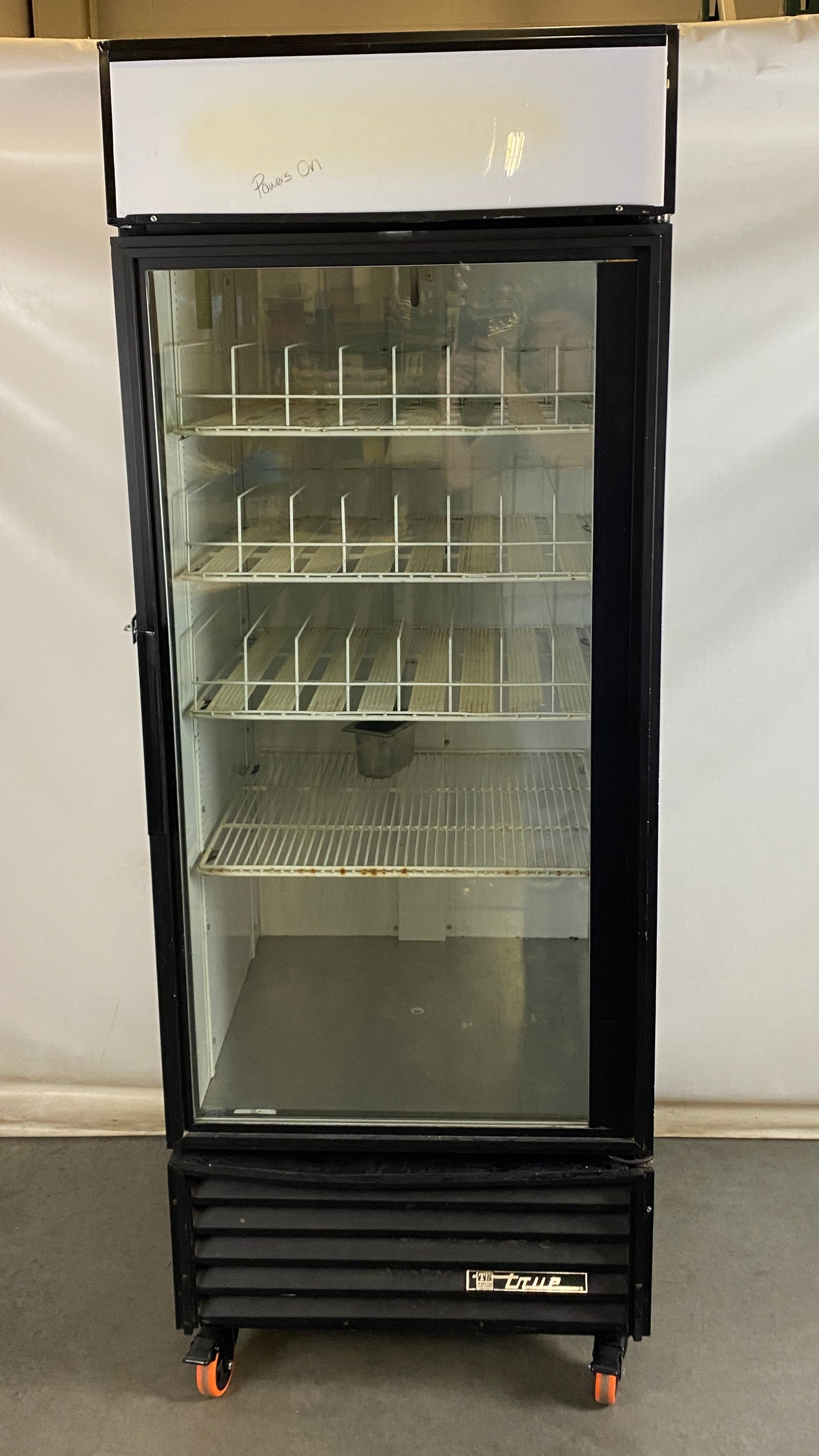 True Manufacturing Company #GDM-026 Black Refrigerator w/ Wheels