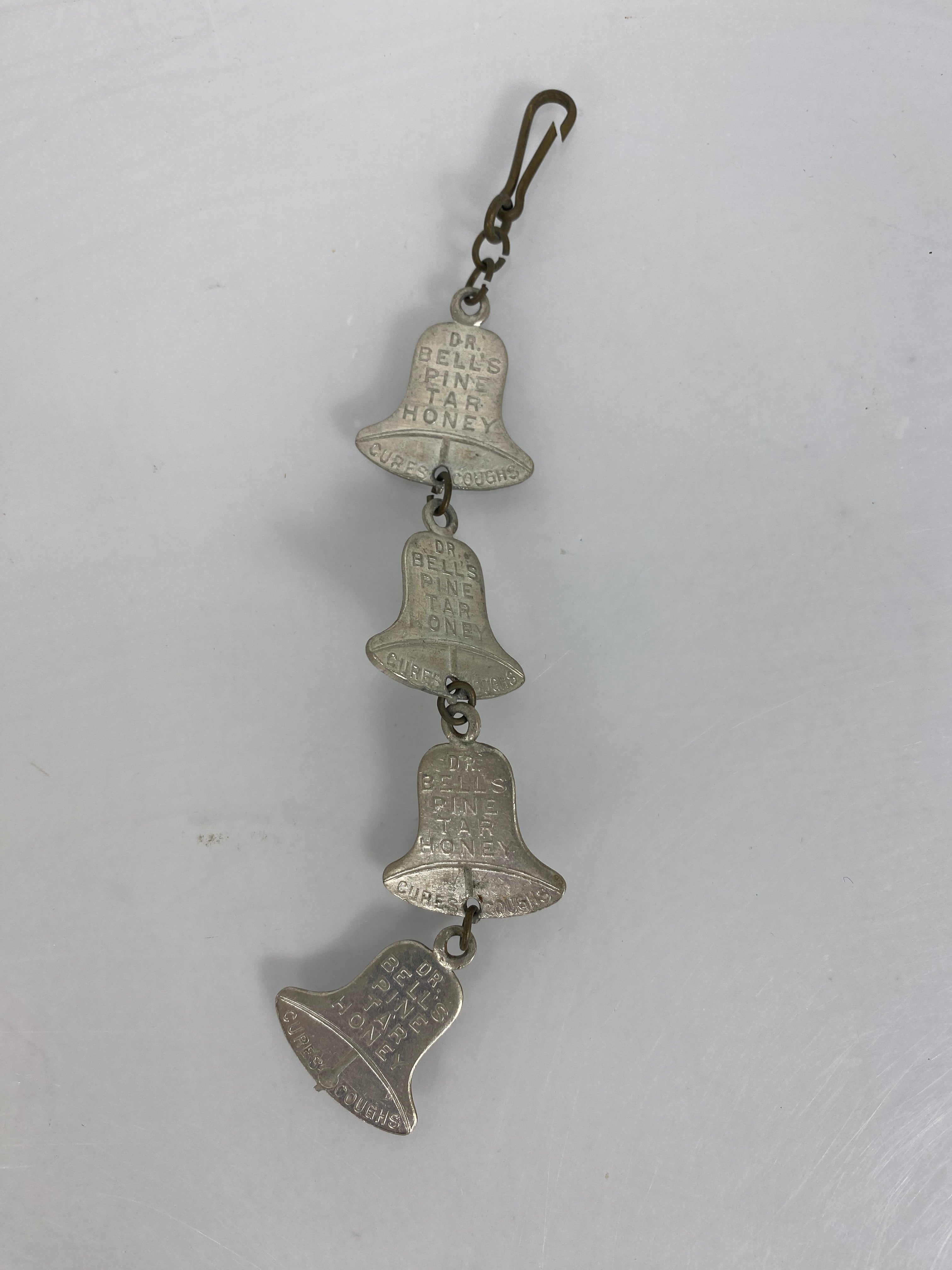 Vintage Advertising Bells Pine Tar Honey String of 4 1" Bells