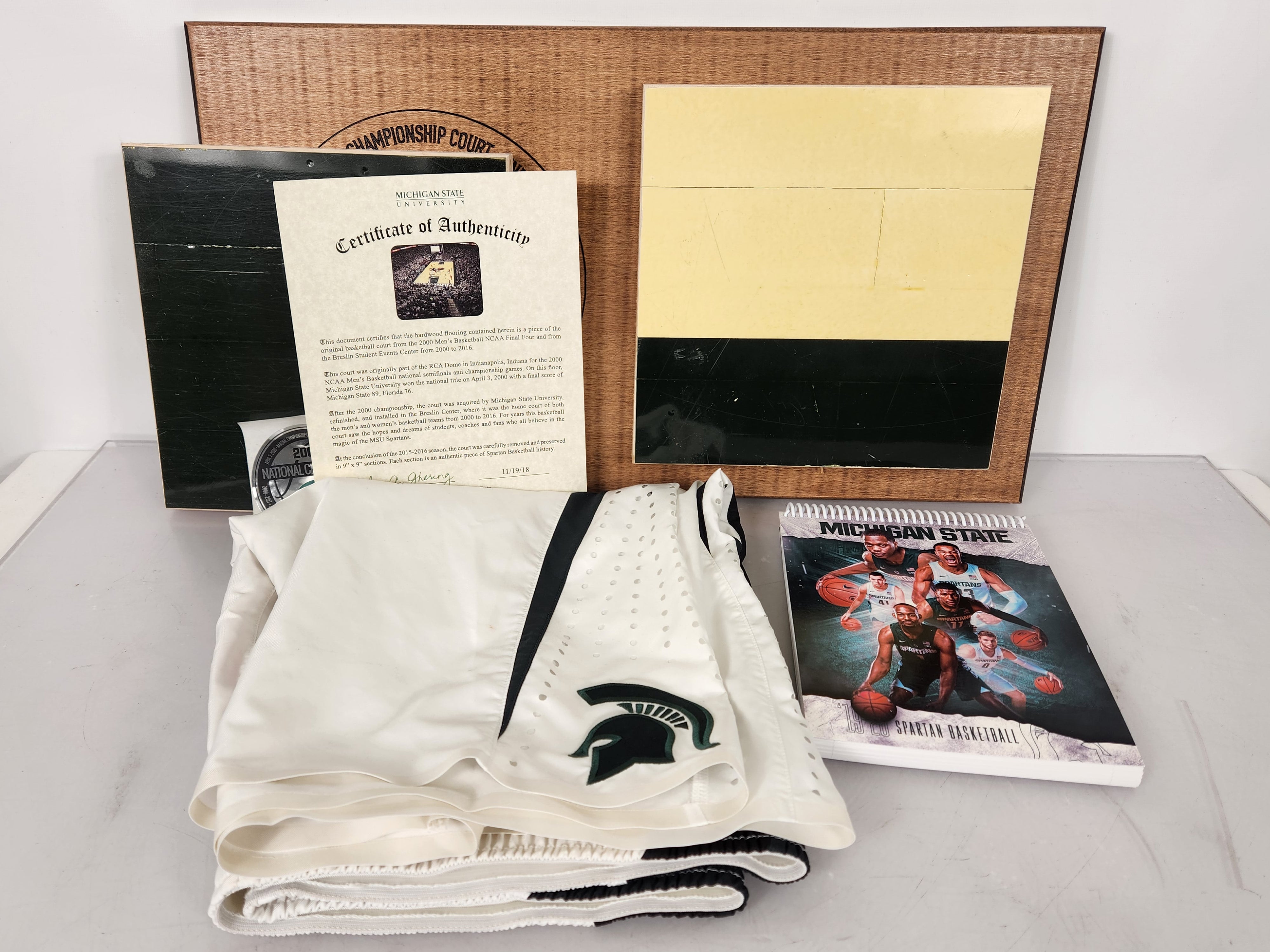 Bundle #26 Basketball Championship Floor Plaque with Women's Basketball Shorts Size 40 and 2019-2020 Basketball Notebook